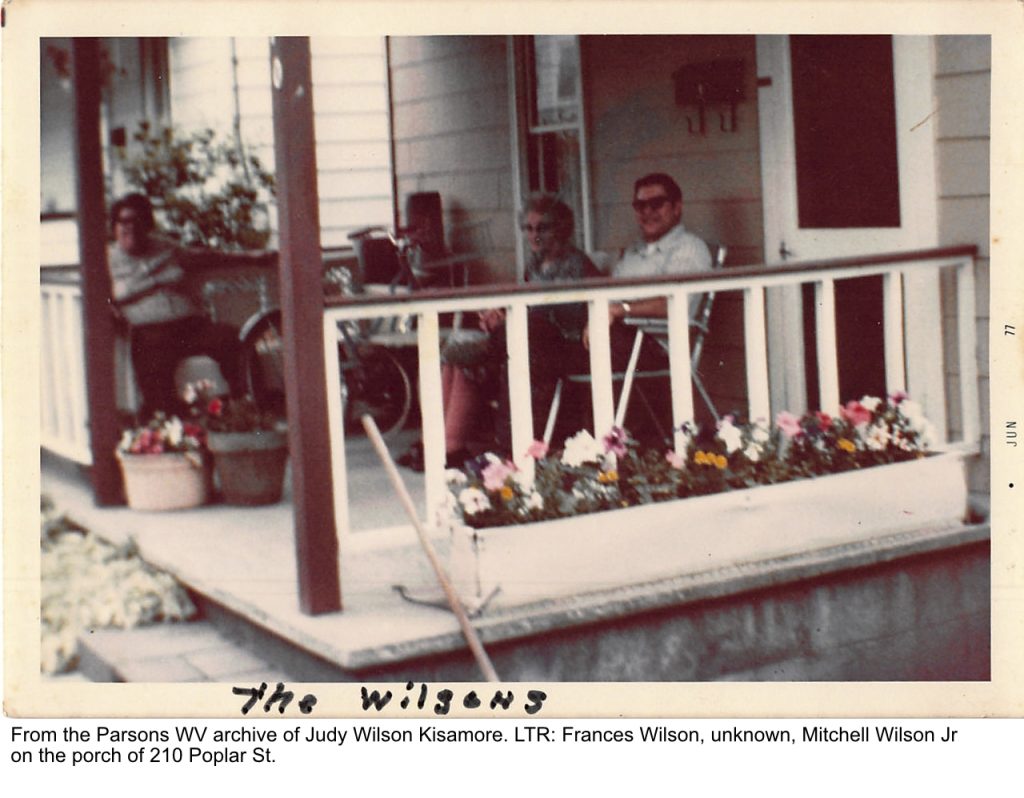 From the Parsons WV archive of Judy Wilson Kisamore. LTR Frances Wilson, unknown, Mitchell Jr on porch of 210 Poplar St.